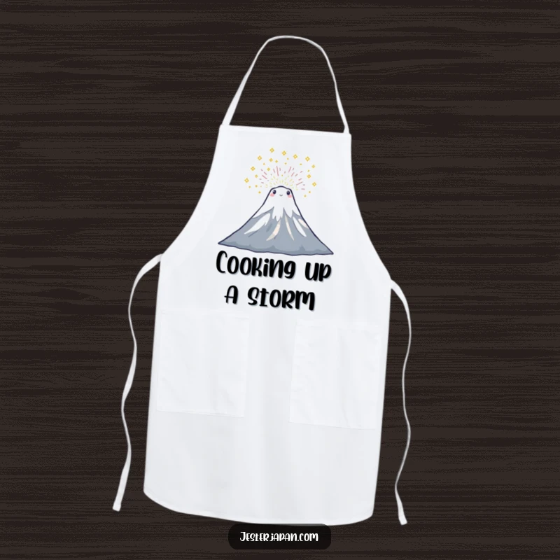 Funny apron showing a tiny Mount Fuji character in a celebratory sparkle eruption, ideal for kitchen fun.