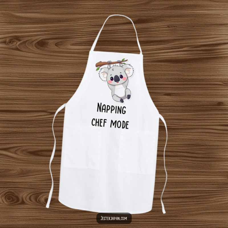 Funny apron showing a koala hanging upside down from a branch, perfect for relaxed cooking and kitchen fun.