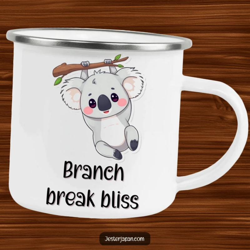Funny camping mug of a koala hanging upside down from a branch, perfect for relaxed outdoor sipping.