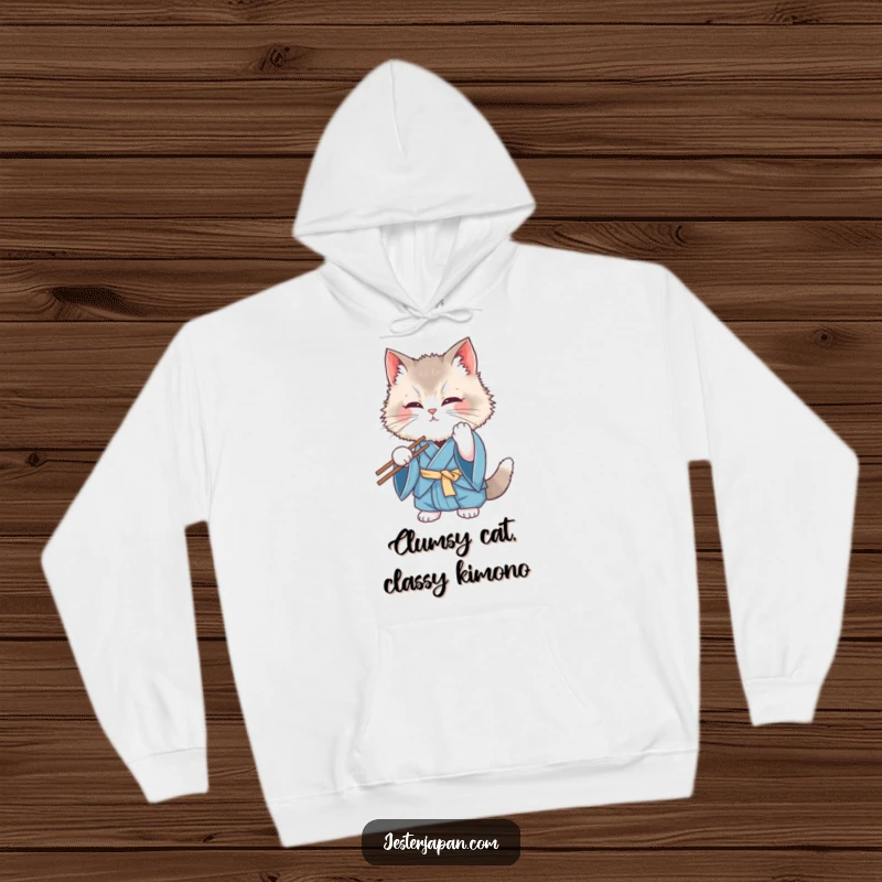 Funny Kimono Cat Hoodie: A fluffy cat in a blue kimono comically struggles with chopsticks, looking bewildered, perfect for cozy, humorous wear.