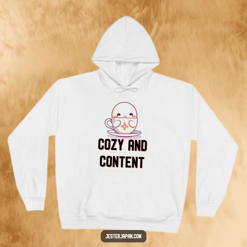 Funny cozy hoodie depicting a small, round Kawaii character happily sipping from a steaming cup, perfect for warmth.