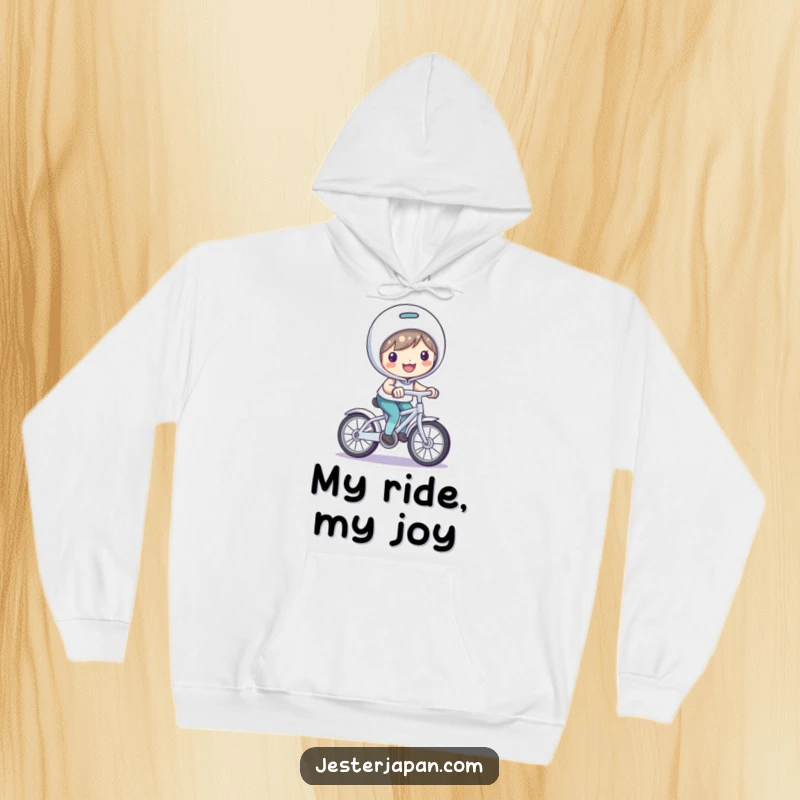 Funny Hoodie: Smiling character riding a small, playful bicycle, radiating happiness.