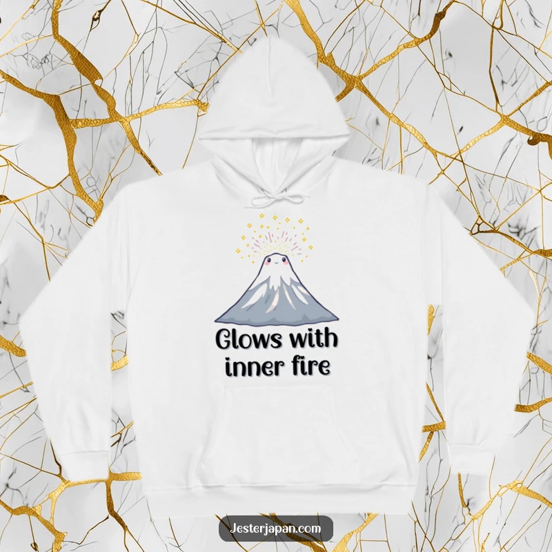 Funny hoodie depicting a tiny Mount Fuji character joyfully erupting with a cascade of glittering sparkles, perfect for warmth.