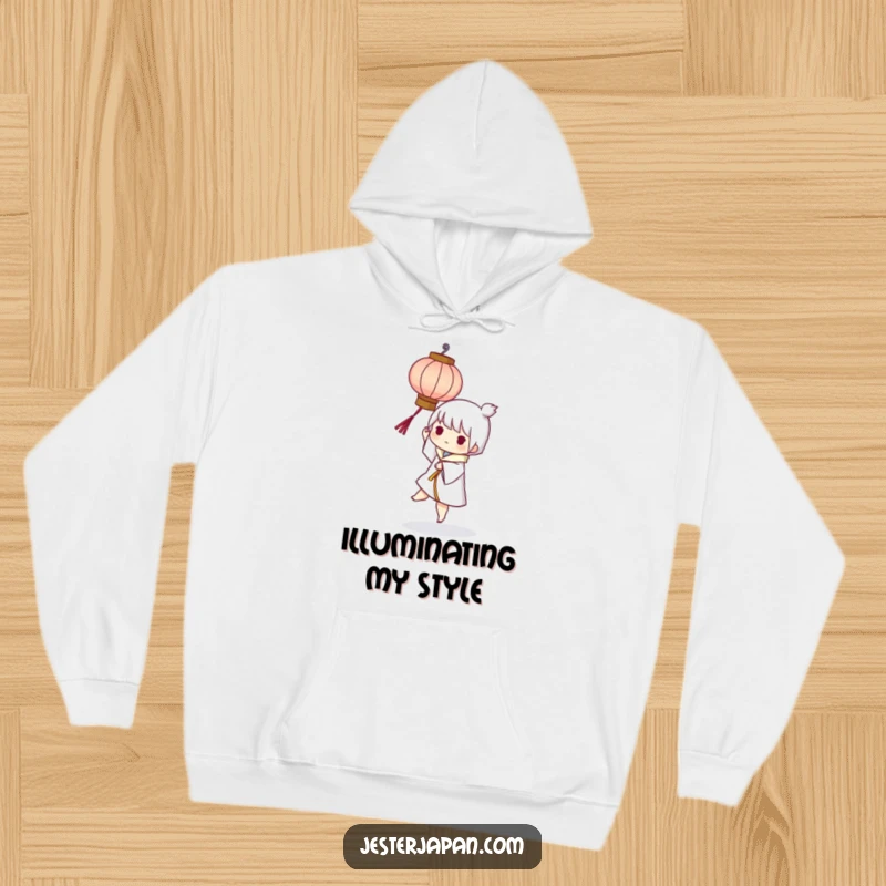 Funny hoodie with a character playfully balancing a small, stylized paper lantern, offering cozy comfort and a warm, humorous glow.