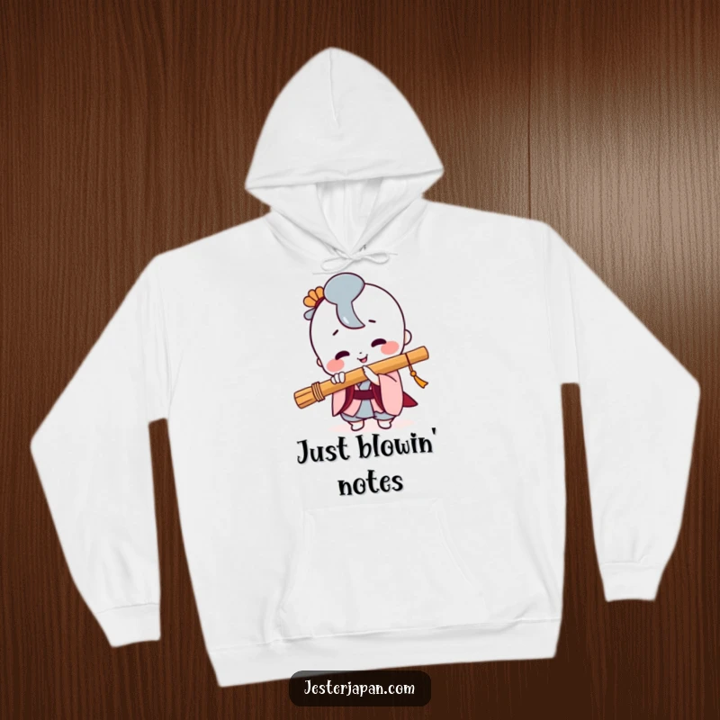 Funny Kawaii hoodie illustrating a cheerful character passionately playing a Japanese flute with a wide, beaming smile.