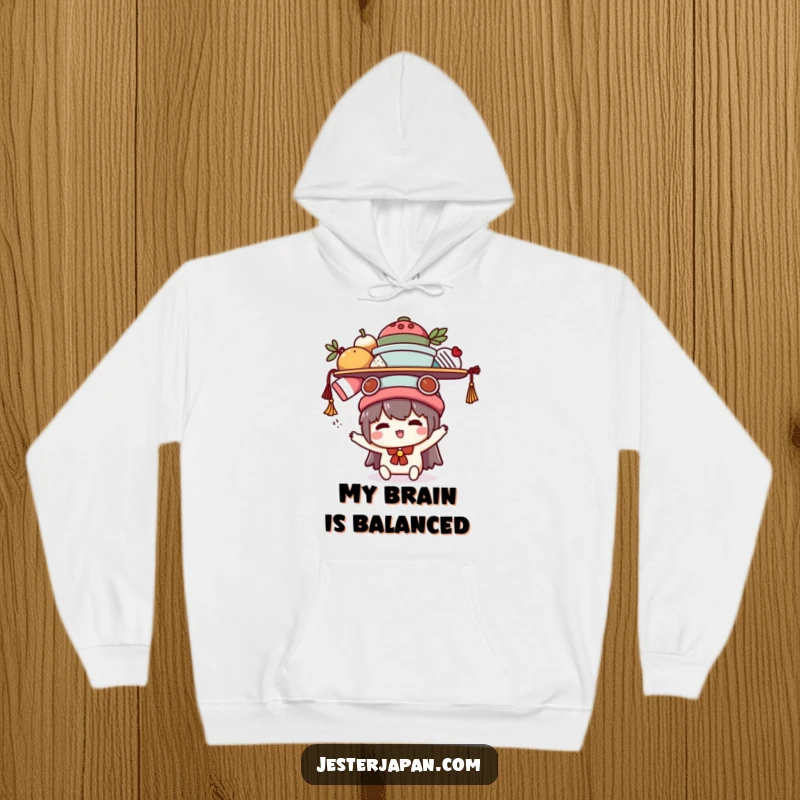 Funny Kawaii hoodie showcasing a cute character struggling humorously to balance multiple items on its head, offering warmth and relatable comedy.