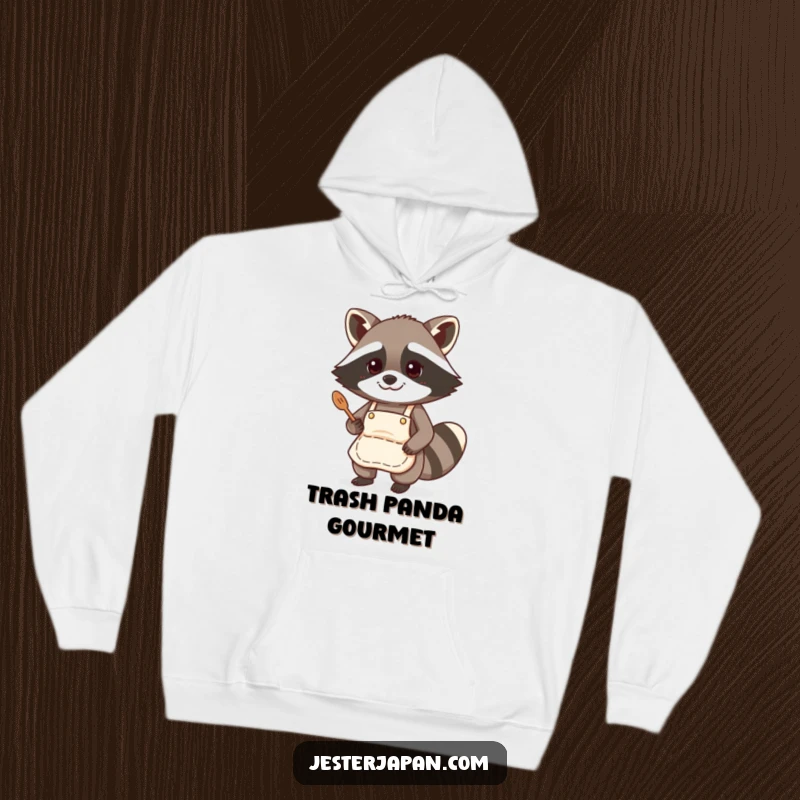 Funny hoodie featuring a raccoon wearing a tiny apron, ready to cook, combining warmth with kitchen-themed humor.