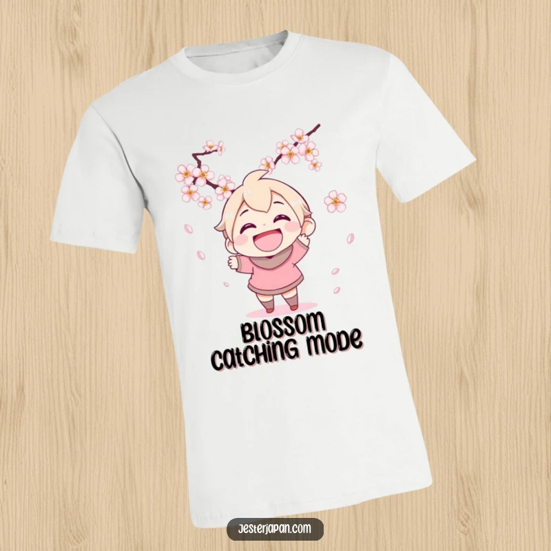 Funny t-shirt with a character grinning widely while trying to catch falling cherry blossoms, capturing the essence of spring's joy.